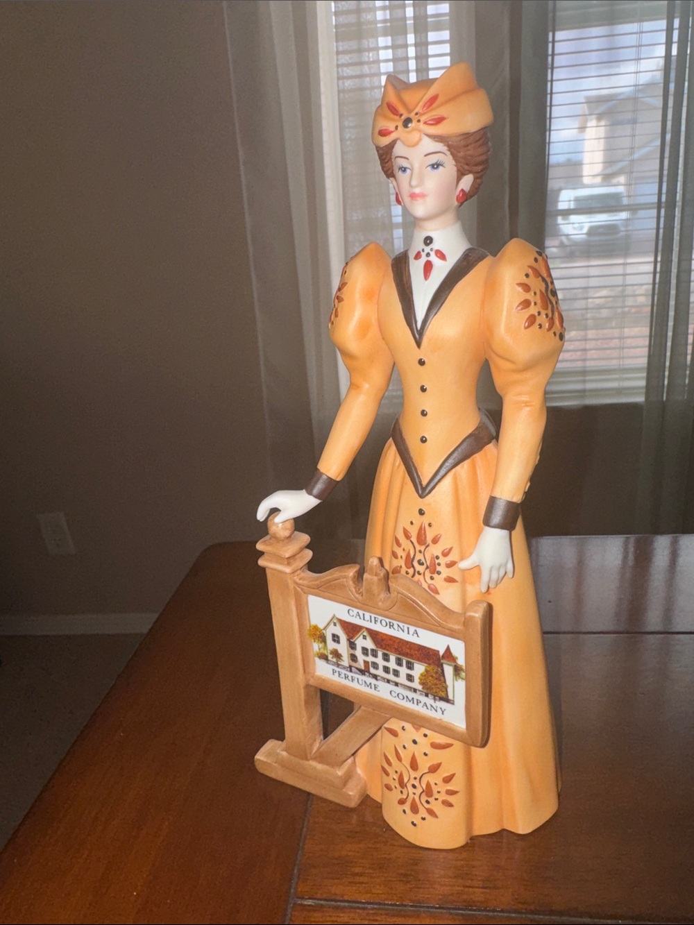 Vintage-Style Female Figurine in Golden Yellow Dress